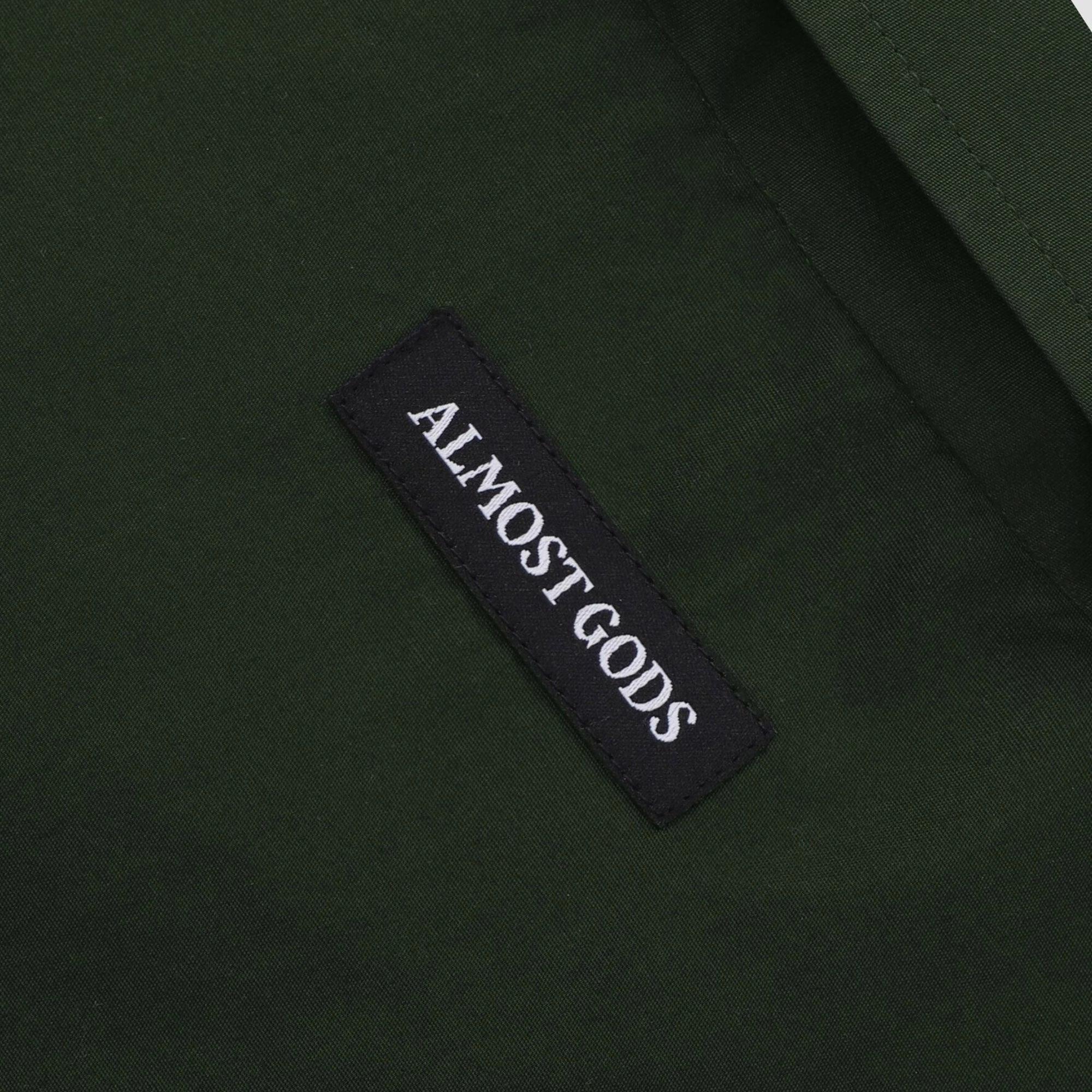 ALMOST GODS | ALPHA CROSS SPRAY PAINT SHIRT { GREEN